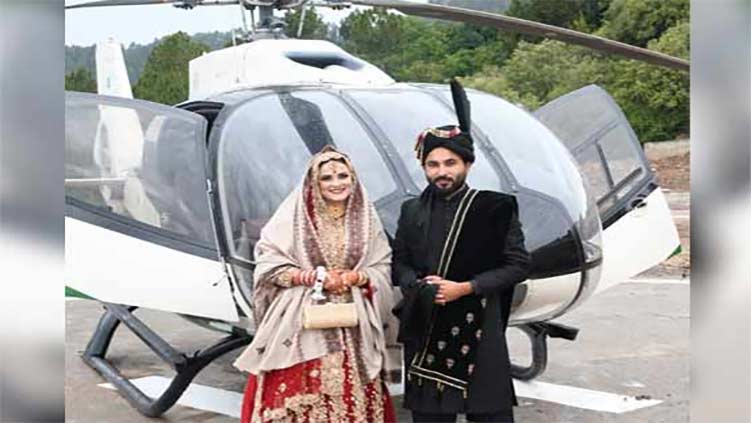 Father-in-law startles groom's side with helicopter for daughter's departure